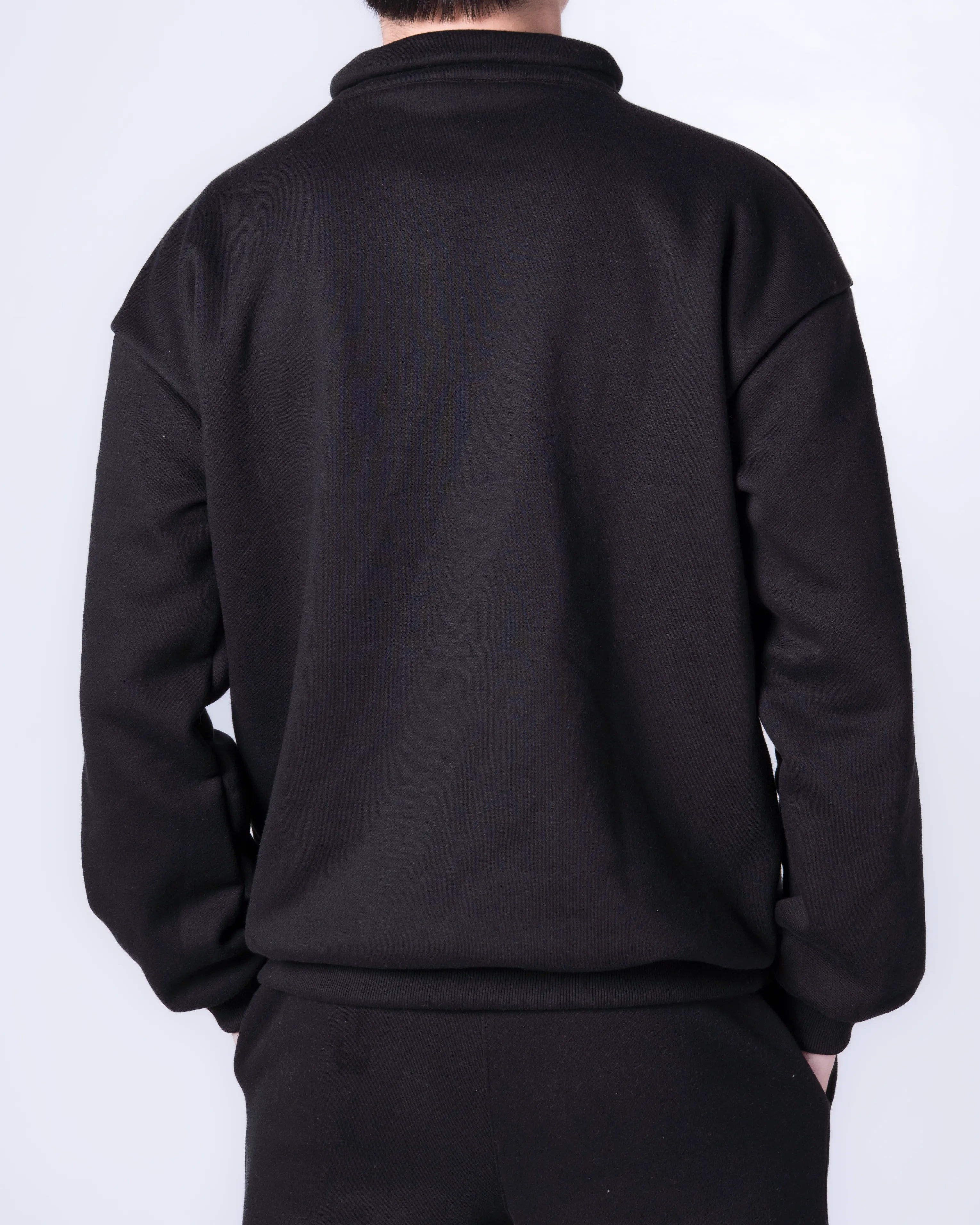 Person wearing a Black jacket on a white background
#color_black