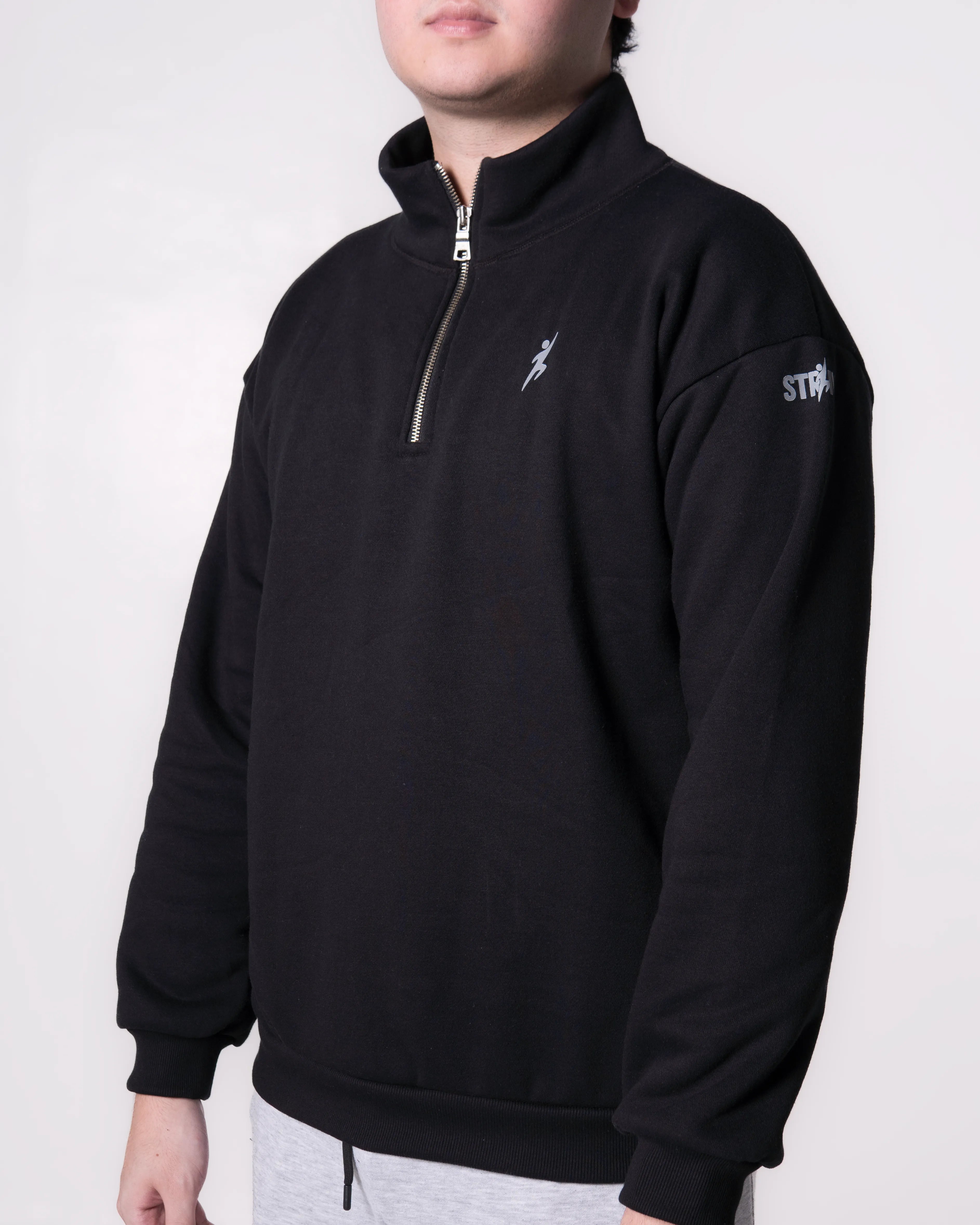 Person wearing a Black pullover with logos on a white background
#color_black