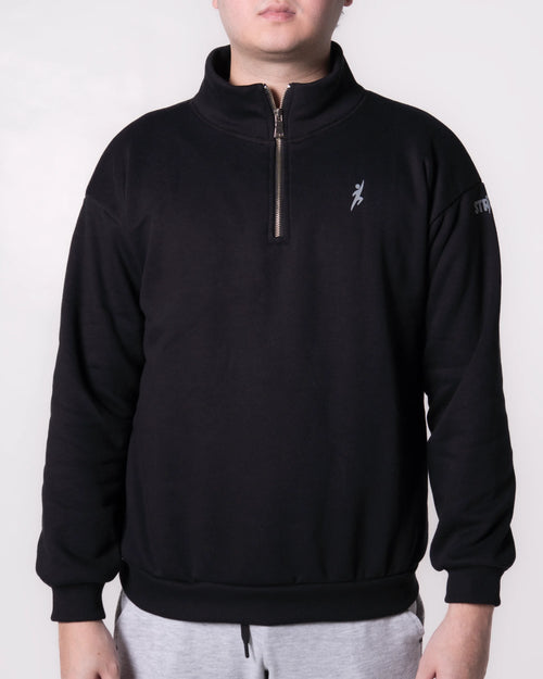 Person wearing a Black quarter-zip sweatshirt with a logo on a white background
#color_black