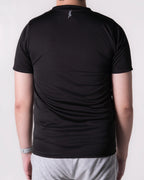 Person wearing a Back t-shirt with a logo on the back against a white 
background
#color_black